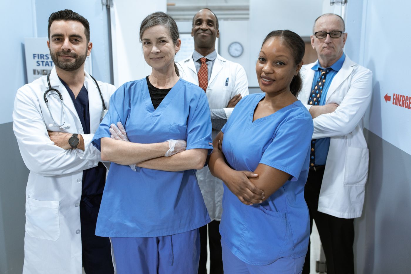 A team of physicians and clinical staff standing together